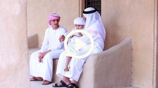 Old man celebrating eid with grandchildren