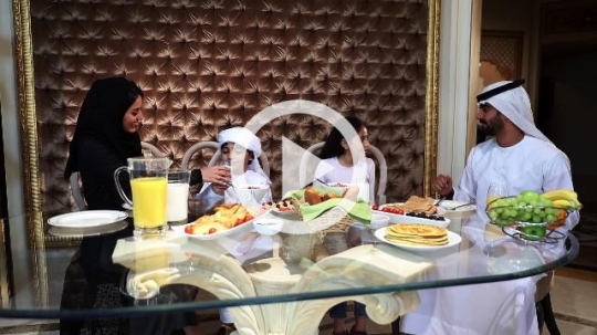 Middle Eastern family having breakfast together|