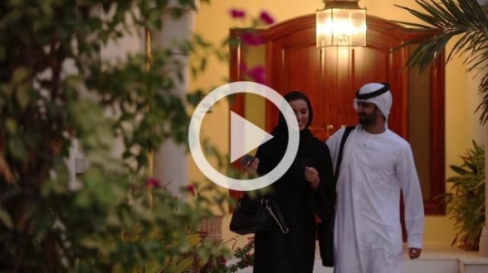 Arab man and woman leaving the house|