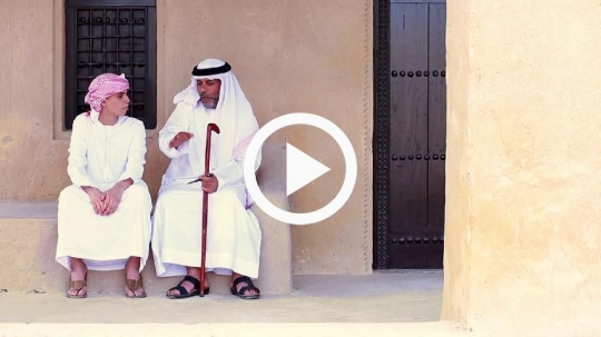 Grandfather enjoying time with teenager