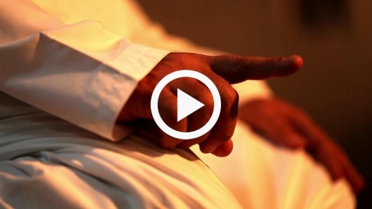 Extreme close-up on finger during prayer