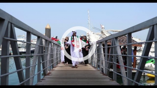 A group of friends and family celebrating the UAE National Day|