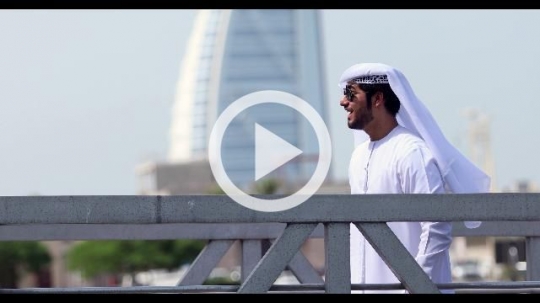 Arab man saying hello to his friend at the dock|