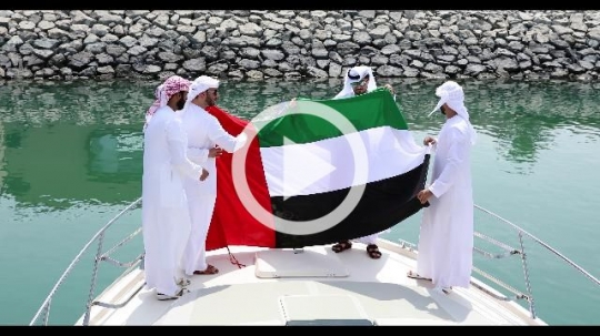 Arab men dressed in the traditional UAE attire decorating the Yacht|