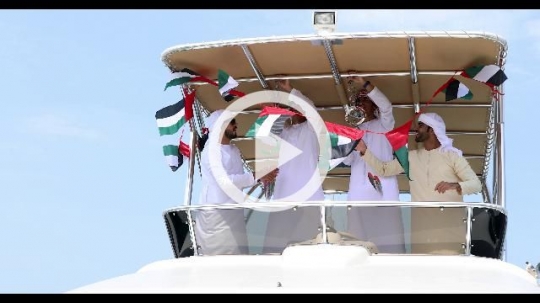 Arab men getting ready for the UAE National Day|