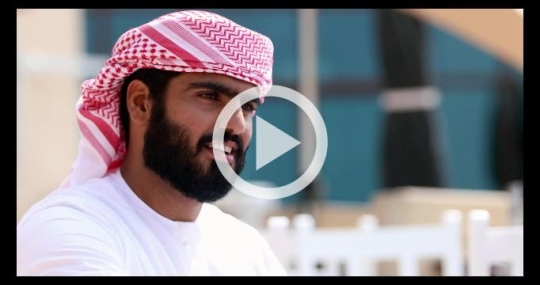 Close up of an arab business man dressed in the traditional attire talking|