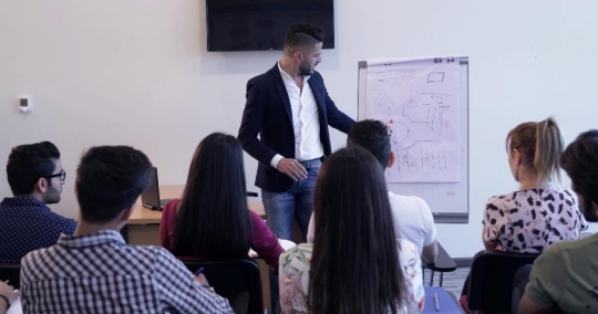 Student asking a question to the professor |-