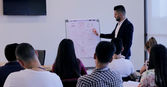 Students focusing in the classroom |-