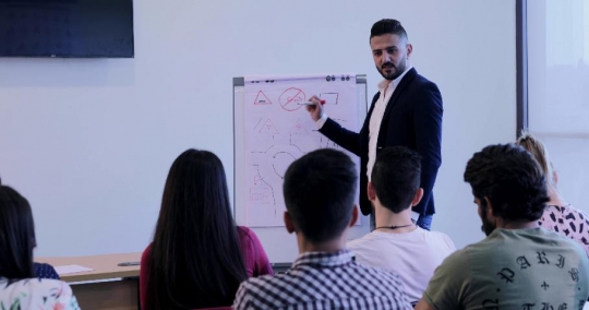 Student asking a question to the professor |-