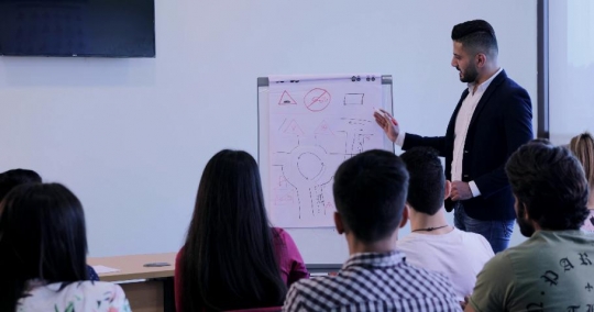 Students in the classroom paying attention |-