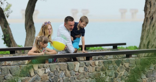 European couple with their kids at the bridge|-