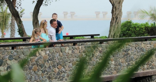 Western Family standing by the bridge|-