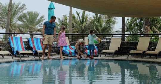 European Family bonding together at the pool|-