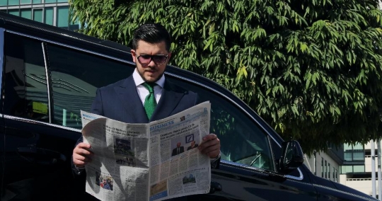 Western Businessman reading the newspaper |-
