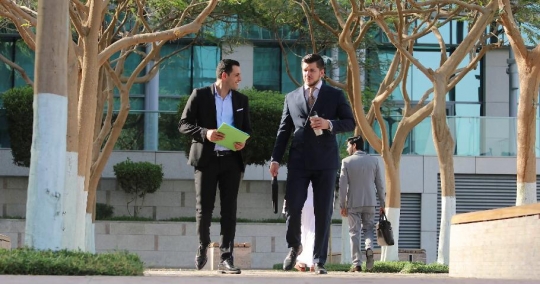 Businessmen walking|-