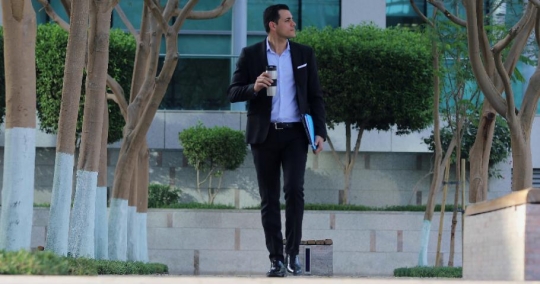 Middle Eastern Businessman drinking coffee|-