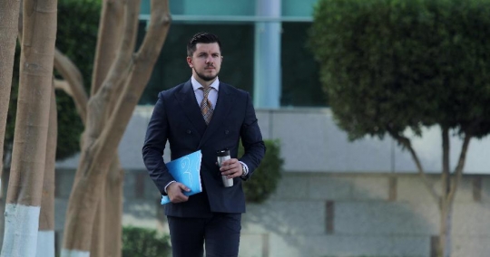 Western Businessman walking and drinking coffee|-