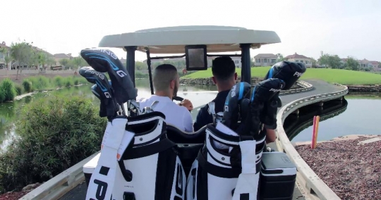 Men driving the Golf Cart at the Resort|-