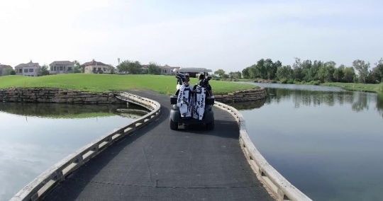 Men driving the Golf Cart|-