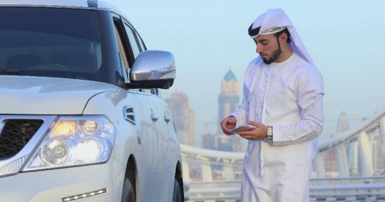 Middle Eastern man on the phone|-