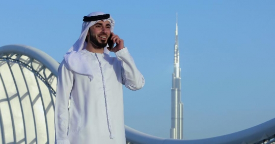 Arab man talking on the phone|-