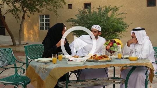 Arab family sitting together during dinner|