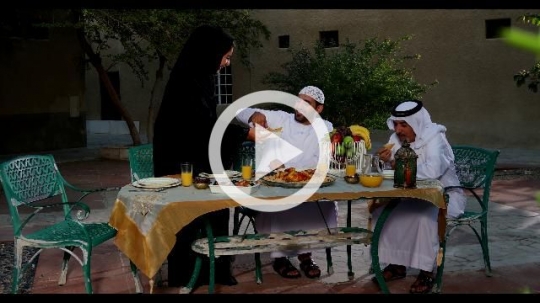 Arabian family praying before Iftar|