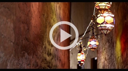 An alleyway decorated by Ramadan Lanterns|