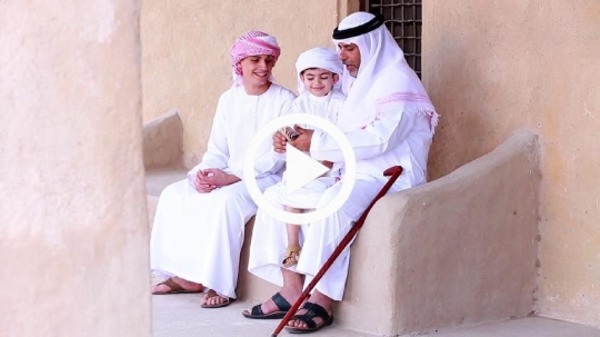 Grandfather giving money on occasion of Eid