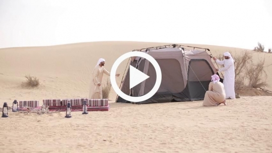 Group of men camping in the desert
