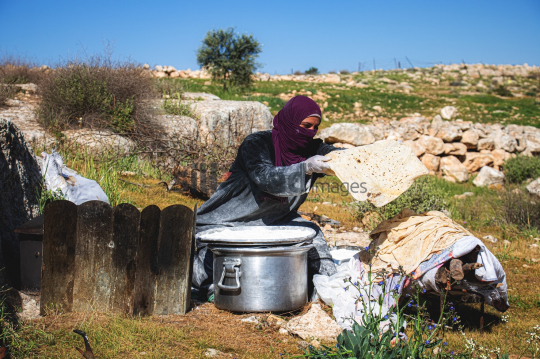 Woman Preparing Traditional Bread Outdoors in Garesa Village