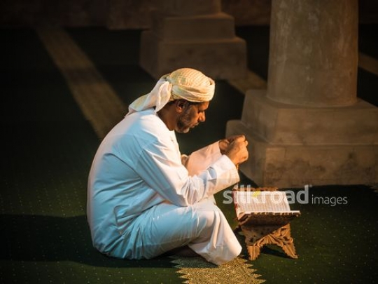 Old man reading qur'an at the mosque|-