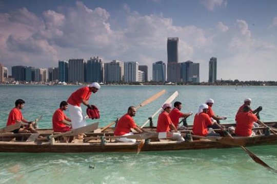 young men paddling in a boat