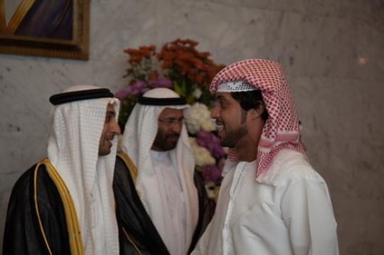 arab men shaking hands in a ce