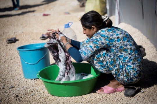 Syrian Woman Washing Clothes in Kobane Refugees Camp