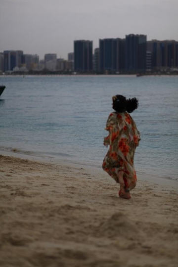 kid running by the beach