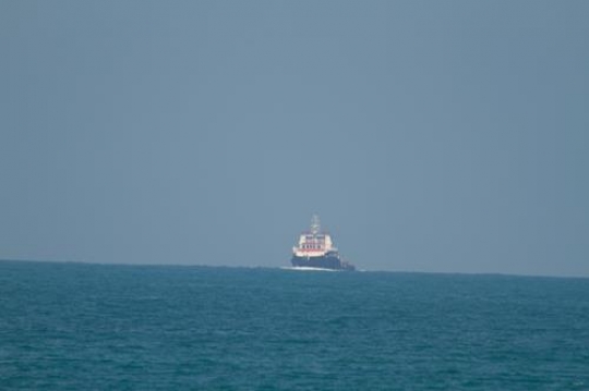 distant ship in the sea