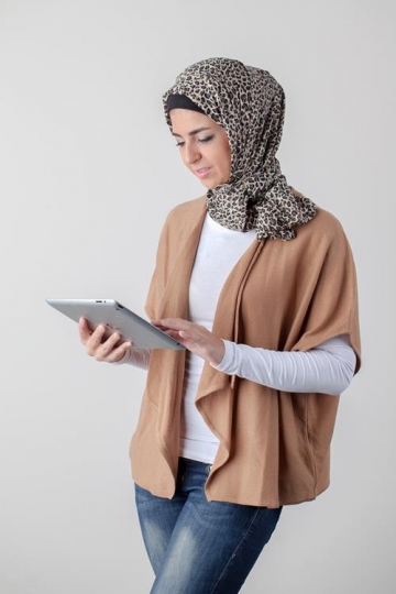 young woman holding ipad