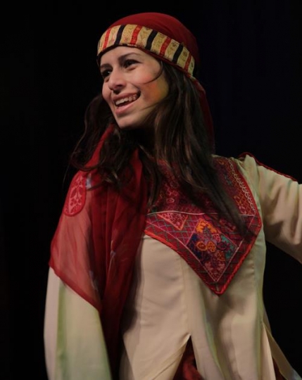 young woman in embroidered dress