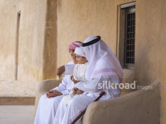 Grandfather giving money to kids|-