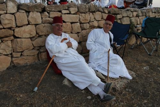 members of the Samaritan community march atop Mount Gerizim, above the West Bank city of Nablus,