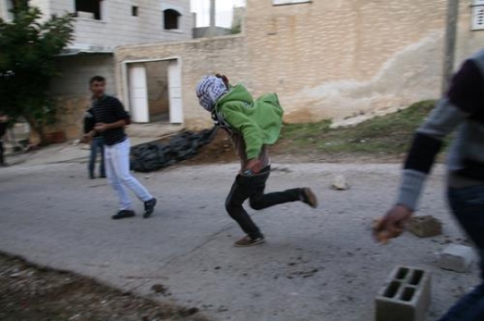 angry protestors throwing stones