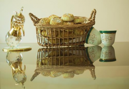 mamoul in straw basket with coffee pot and cups