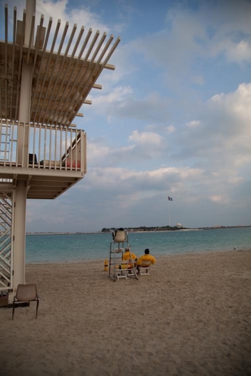 men looking at the beach