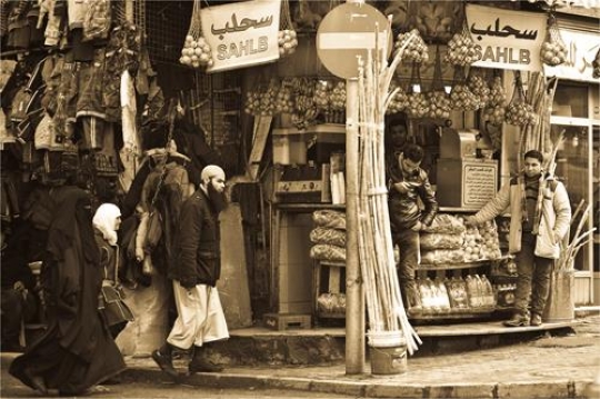 family walking in an old market place