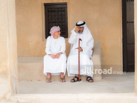 Teenager spending time with grandfather|-