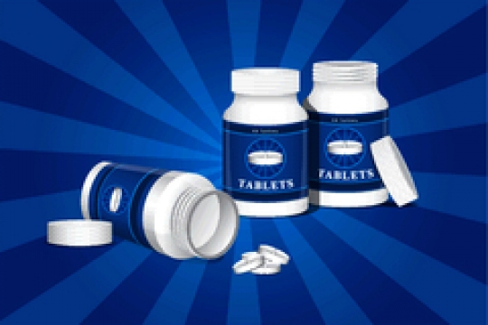 bottle for tablets on blue background