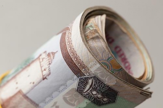 an uae dirhams rolled up