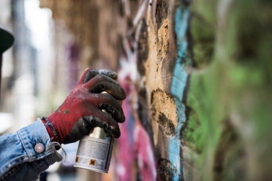 Graffiti Guy Spraying on Wall in Karakoy - Karaköy Istanbul