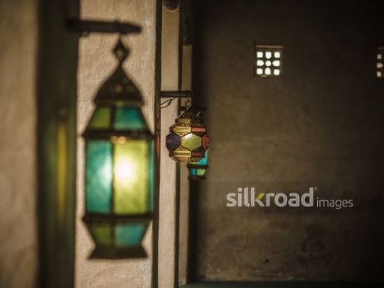 Colourful lanterns hanging on the wall|-